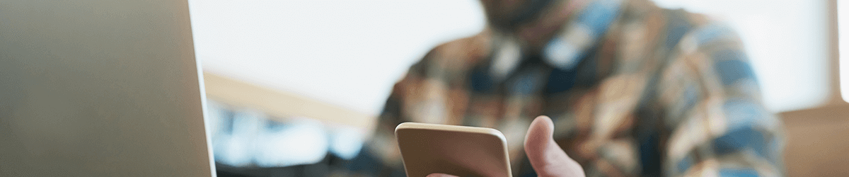 Close-up of a man holding a smartphone